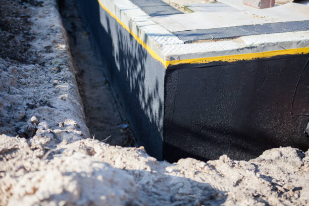 Professional Waterproofing technician working in Harrison, MI